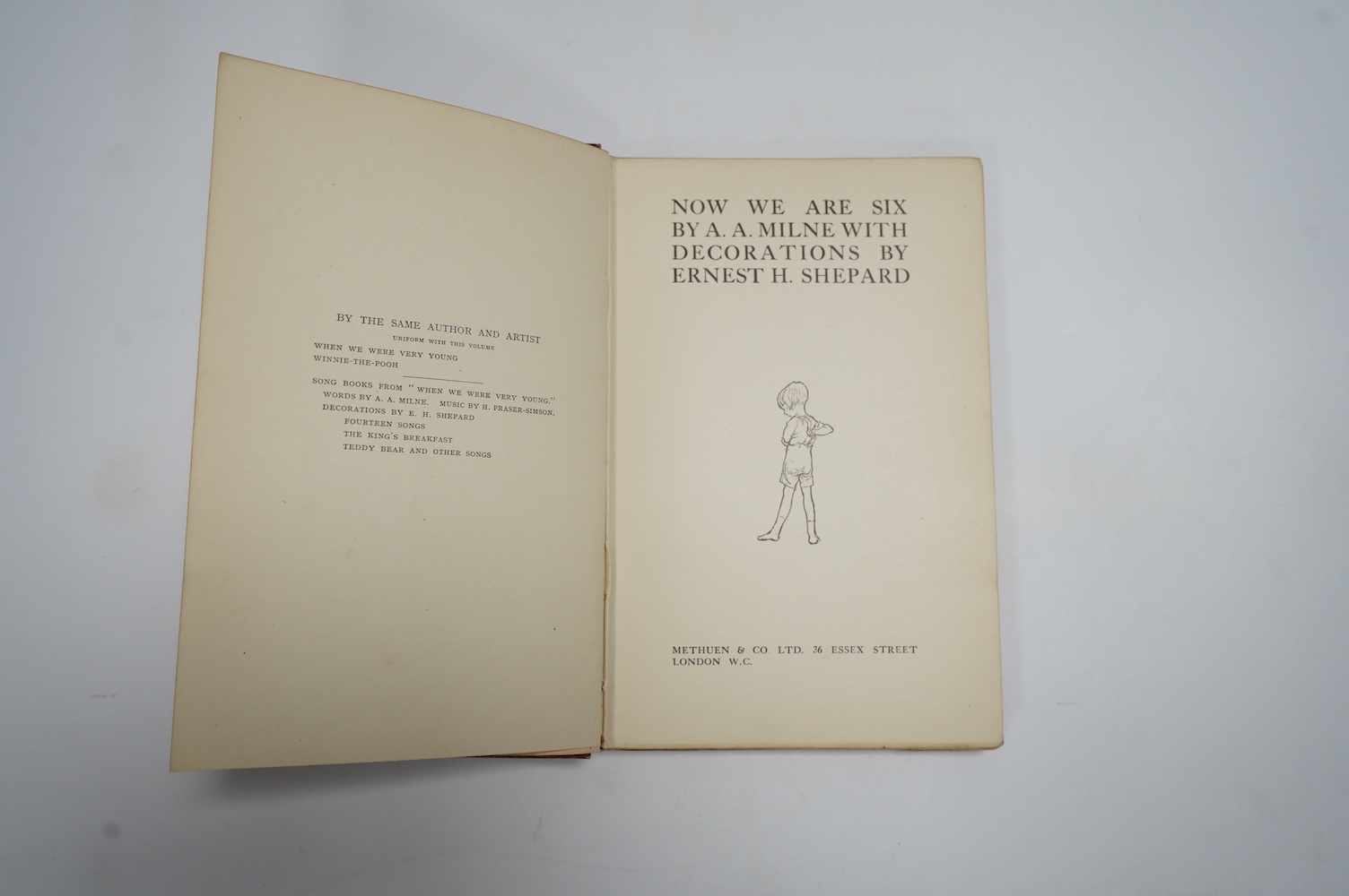 Milne, A.A. - Now We Are Six. with decorations by Ernest H. Shepard. First Edition title and other illus. throughout, and on e/ps.; publisher's gilt ruled and pictorial red cloth, gilt top, sm.8vo. Methuen, 1927